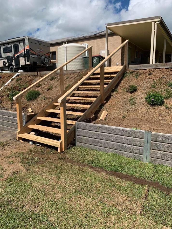 A Set of Wooden Stairs Leading up To a House — Entire Trades in Maitland, NSW