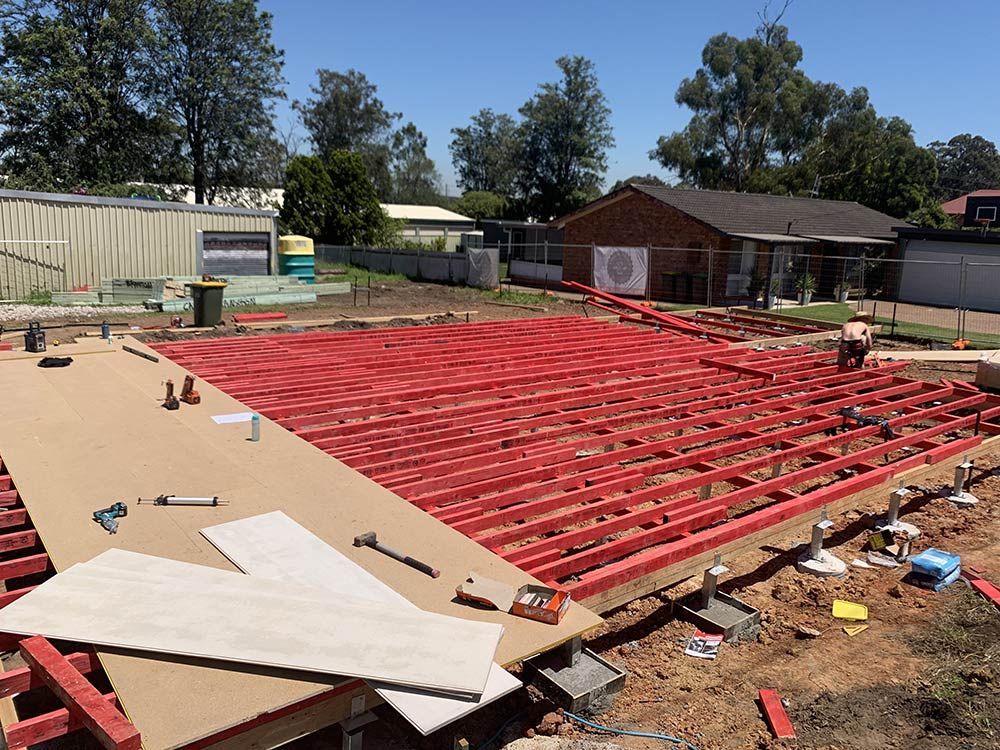 A Large Wooden Deck Platform Is Being Built In A Yard — Entire Trades in Port Stephens, NSW