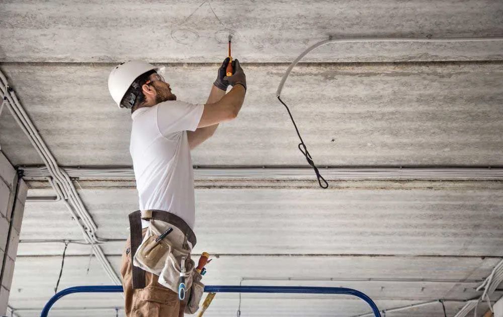 Asp Level 2 Electrician Checking Electrical Cable — Entire Trades in Port Stephens, NSW