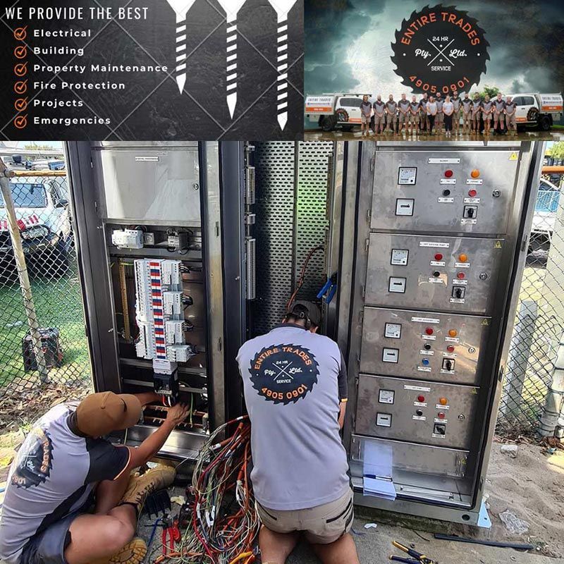 Two Men Are Repairing A Power Panel — Entire Trades in Port Stephens, NSW