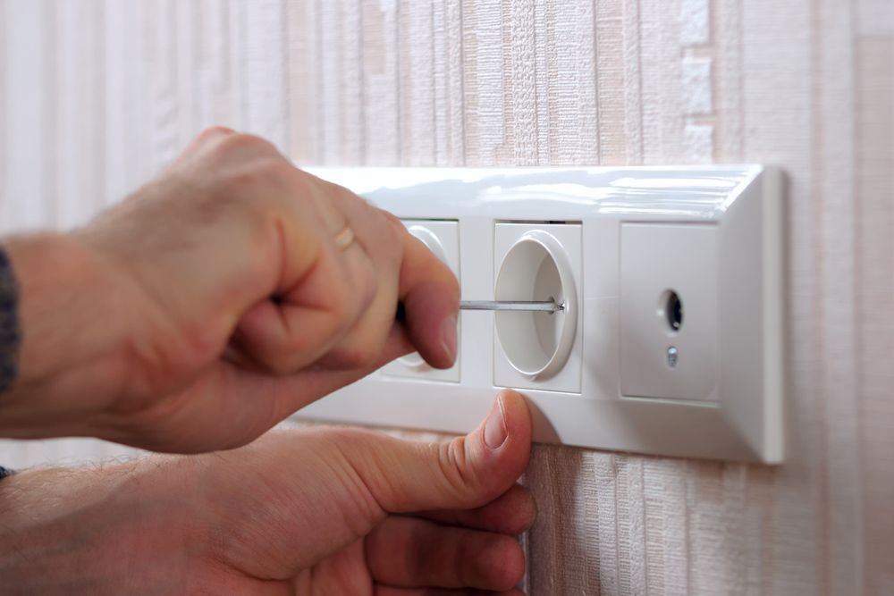 Emergency Electrician Fixing Electrical Outlet