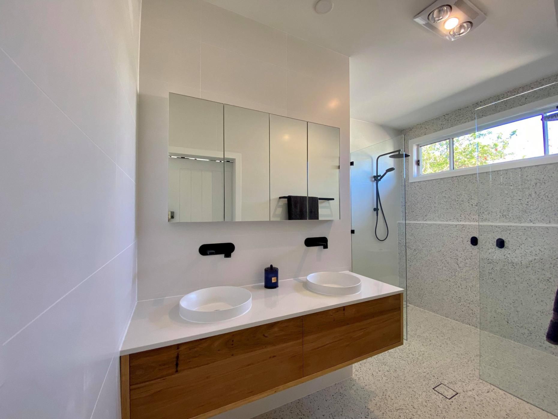 A Bathroom with Two Sinks, a Mirror and A Walk in Shower — Entire Trades in Maitland, NSW