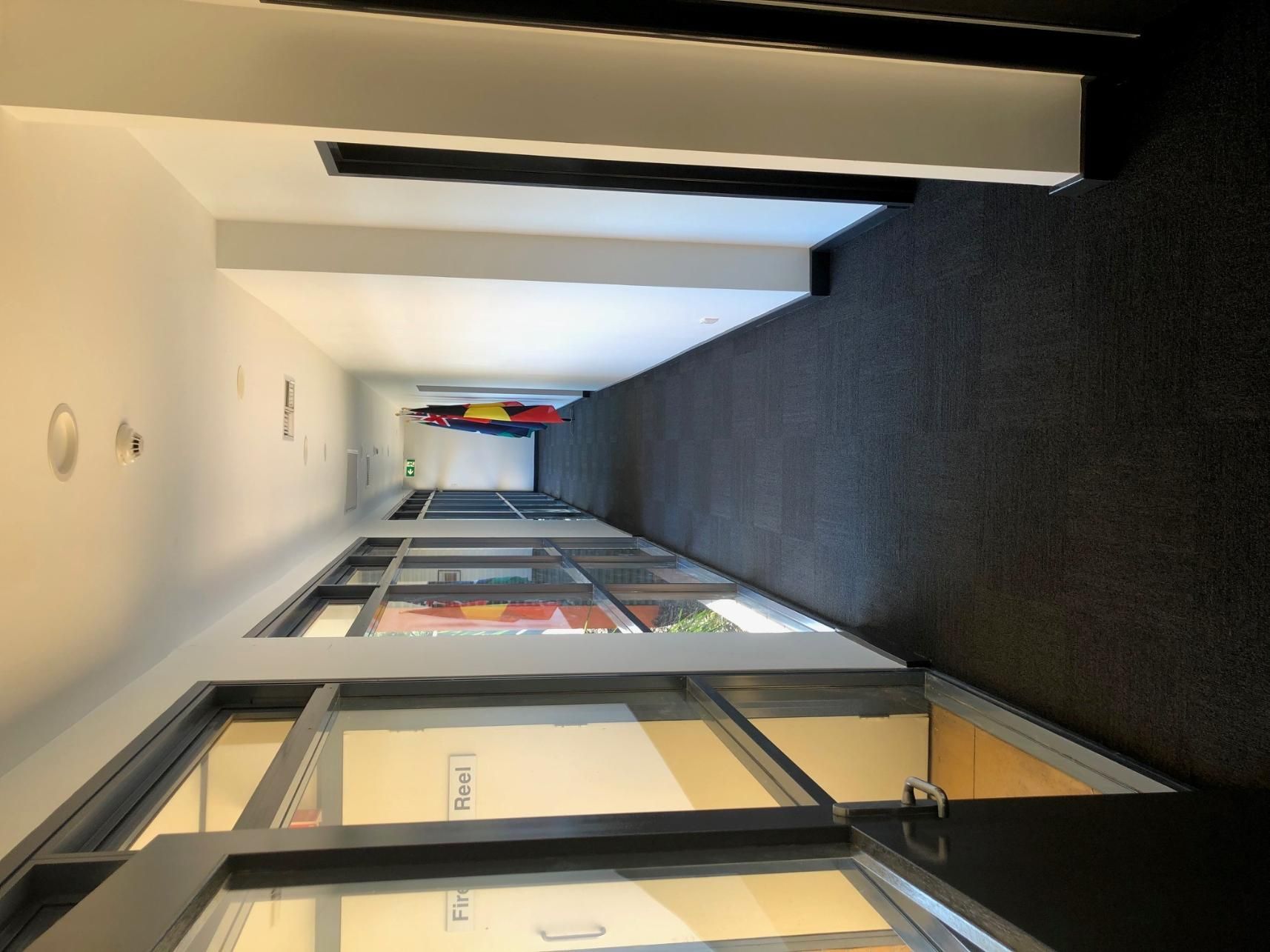 A Long Hallway with A Lot of Windows and Doors — Entire Trades in Maitland, NSW