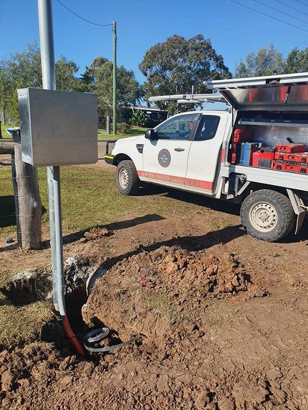 An Entire Trades Truck Parked Beside An Electrical Hole In The Ground — Entire Trades in Port Stephens, NSW