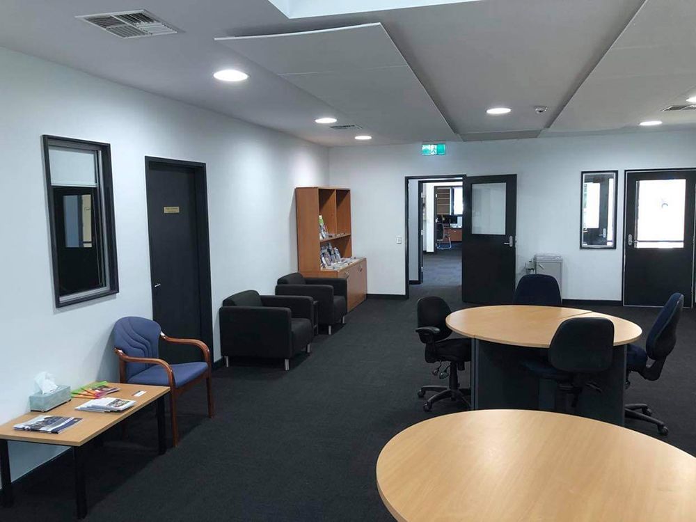 Office Room With Tables And Chairs And Open Lights — Entire Trades in Singleton, NSW
