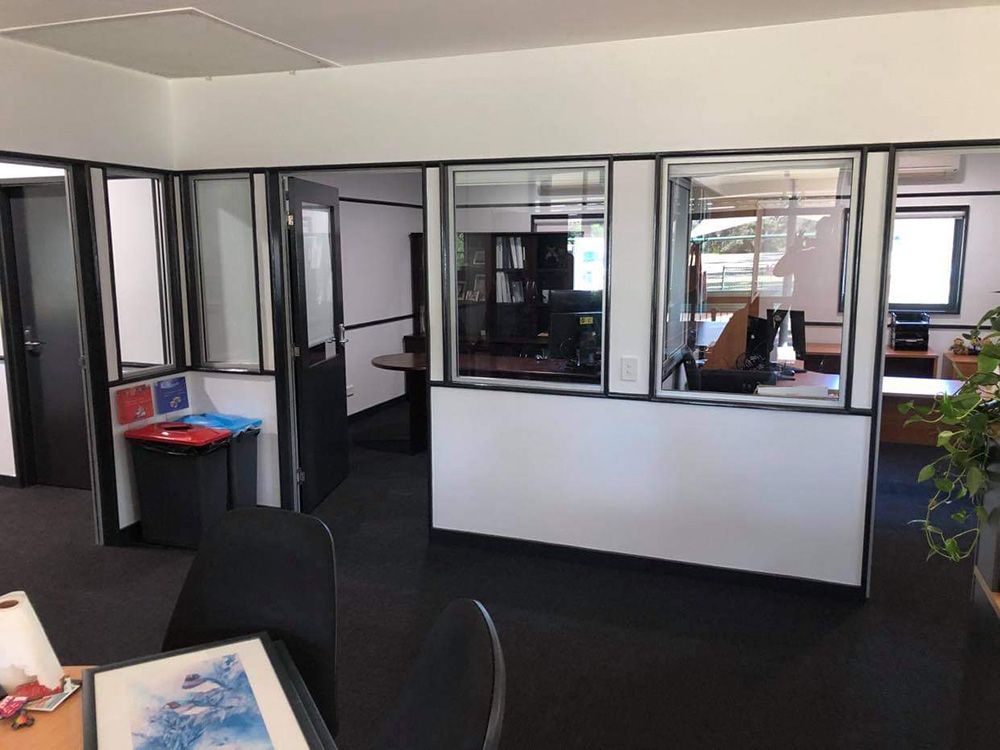 An Office With A Desk And Stylish Black And White Walls — Entire Trades in Port Stephens, NSW