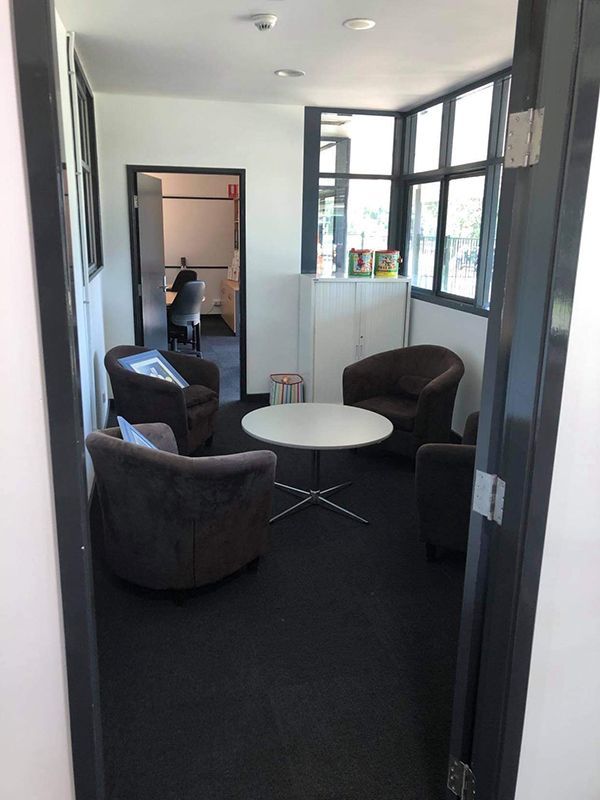 A Room Furnished With Chairs And A Table — Entire Trades in Port Stephens, NSW