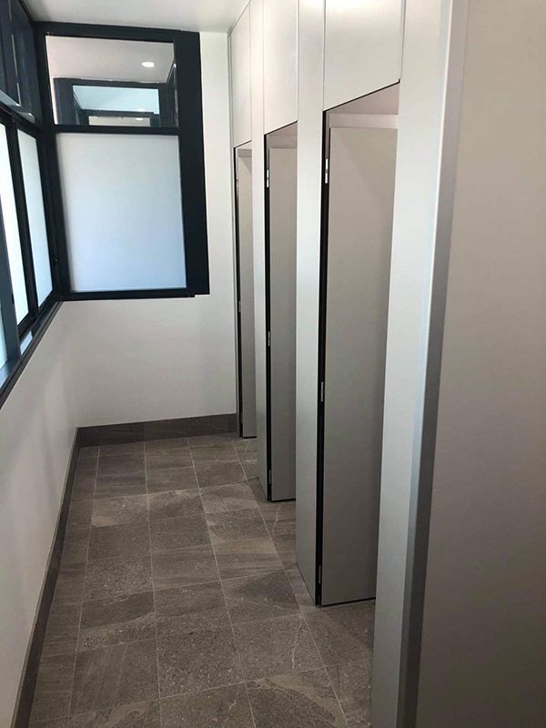 White Restroom Stalls In A Row — Entire Trades in Port Stephens, NSW
