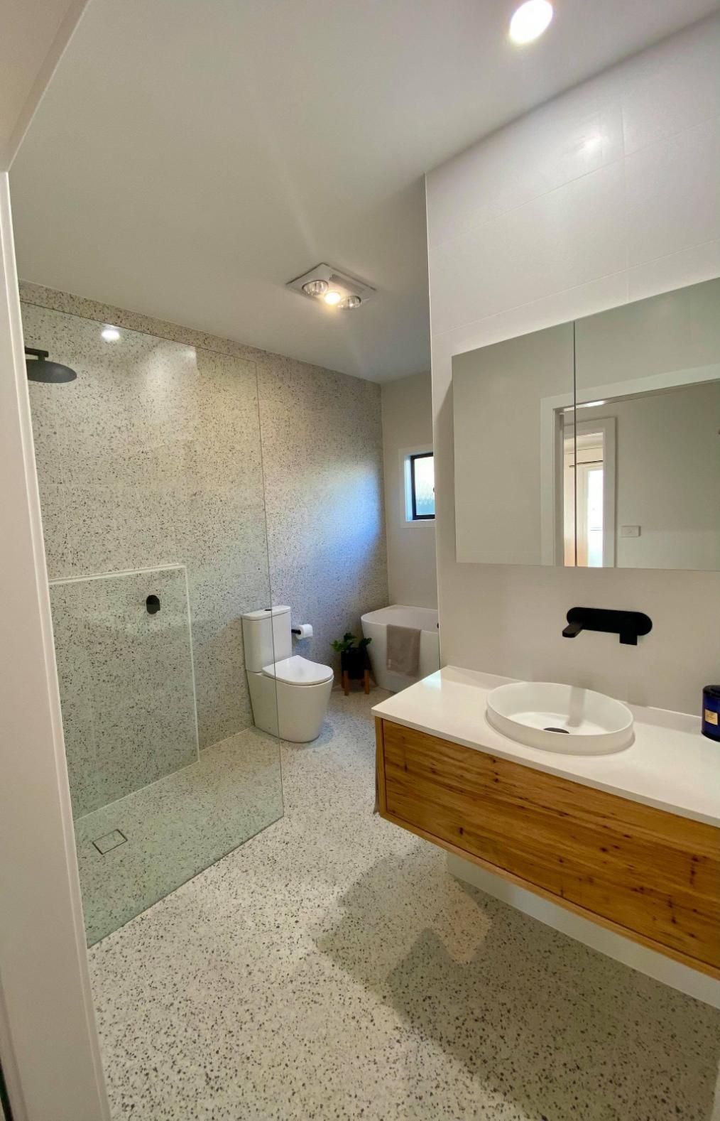 A Bathroom with A Sink , Toilet , Shower and Mirror — Entire Trades in Maitland, NSW
