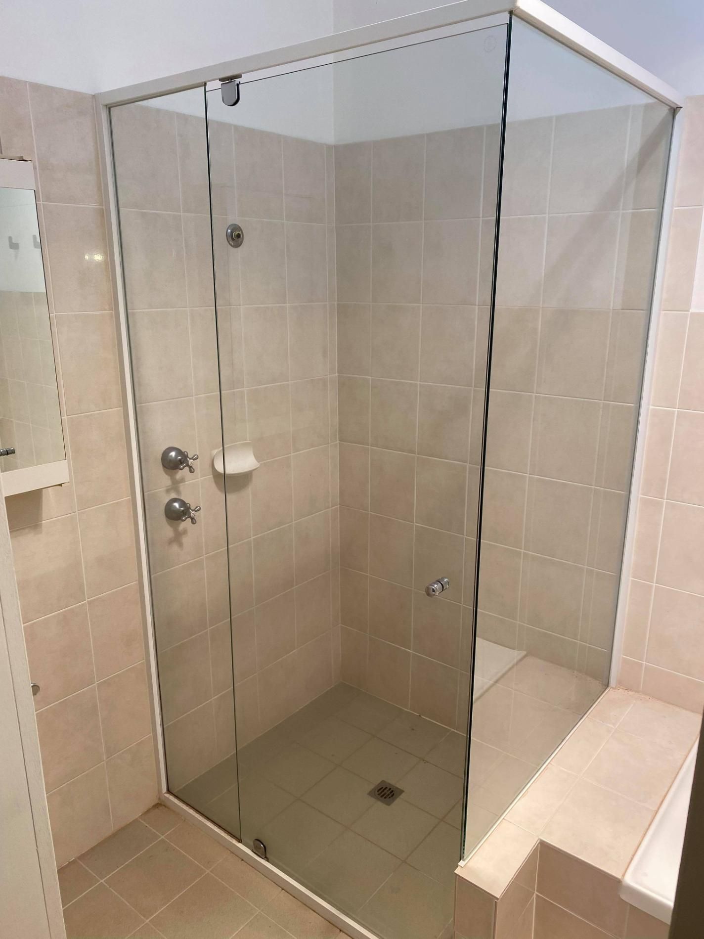 A Bathroom with A Walk in Shower with A Glass Door — Entire Trades in Maitland, NSW
