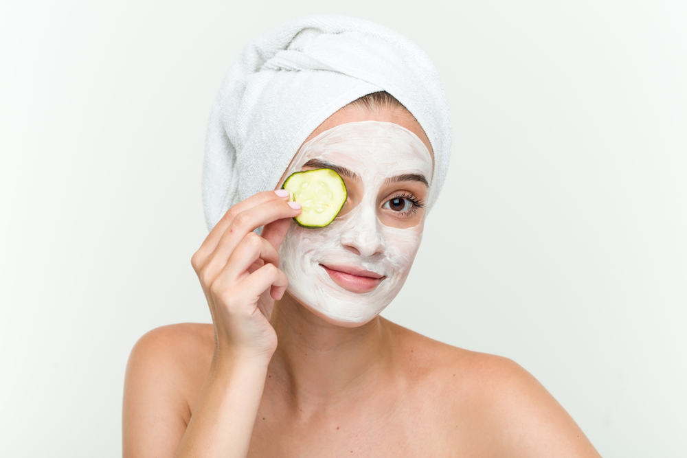 A woman is getting a facial treatment at a spa.