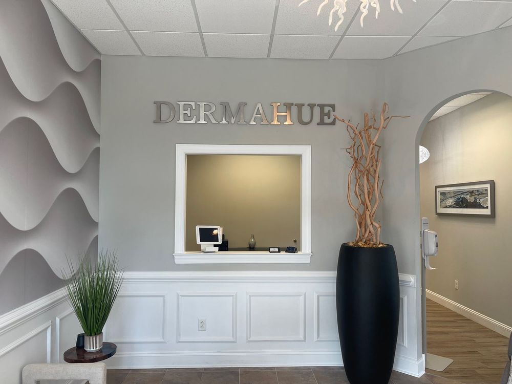 A waiting room with a sign that says dermahue