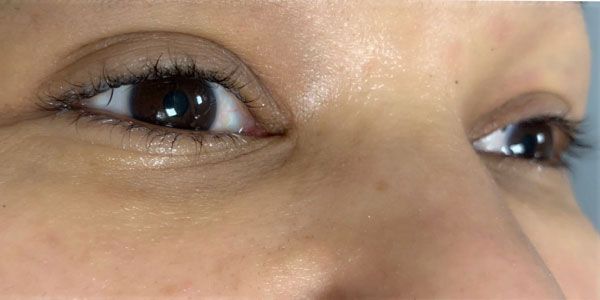 A close up of a woman 's eyes with mascara on.