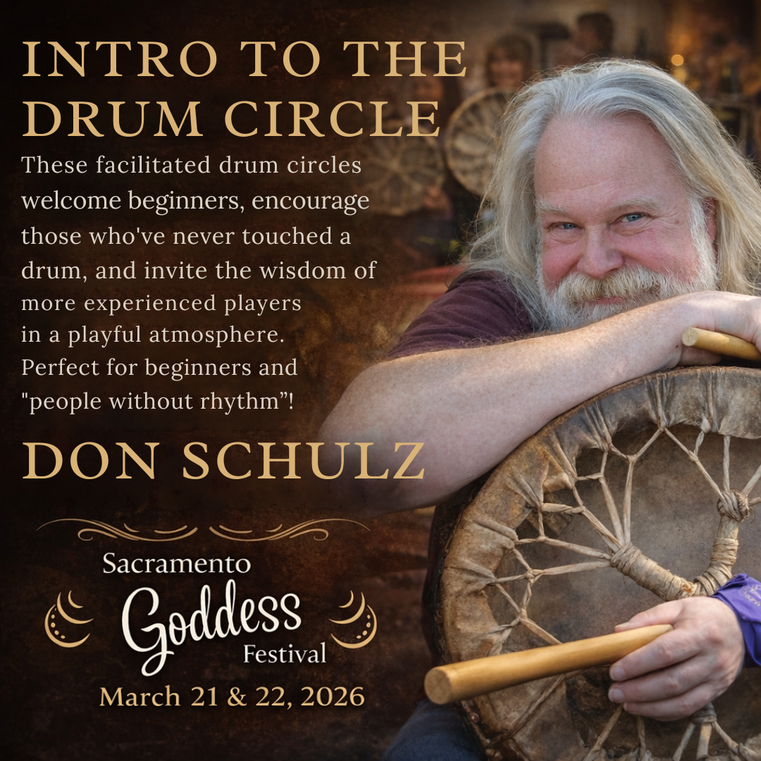 Man with long, white hair and beard smiles, leaning on a dark, patterned chair in an outdoor setting.