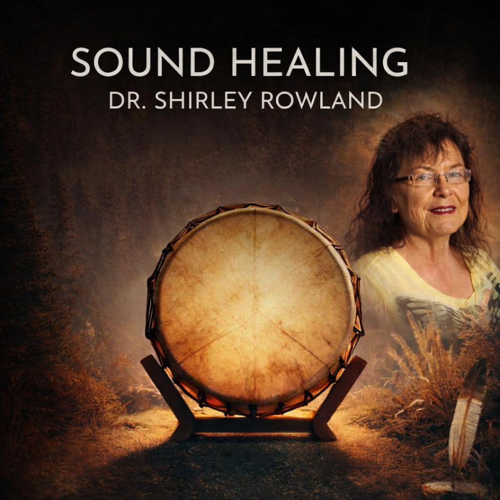 Dr. Shirley Rowland, with a drum, promotes sound healing. Brown and gold tones; outdoors setting.