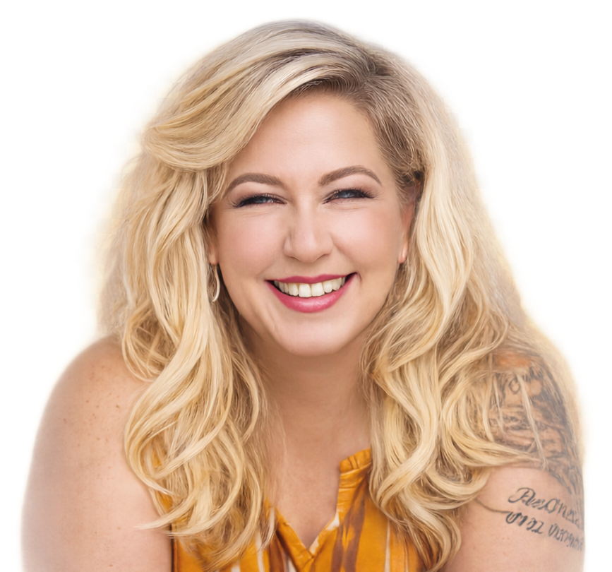 Woman with blonde hair smiles, wearing an orange top, tattoo on arm.