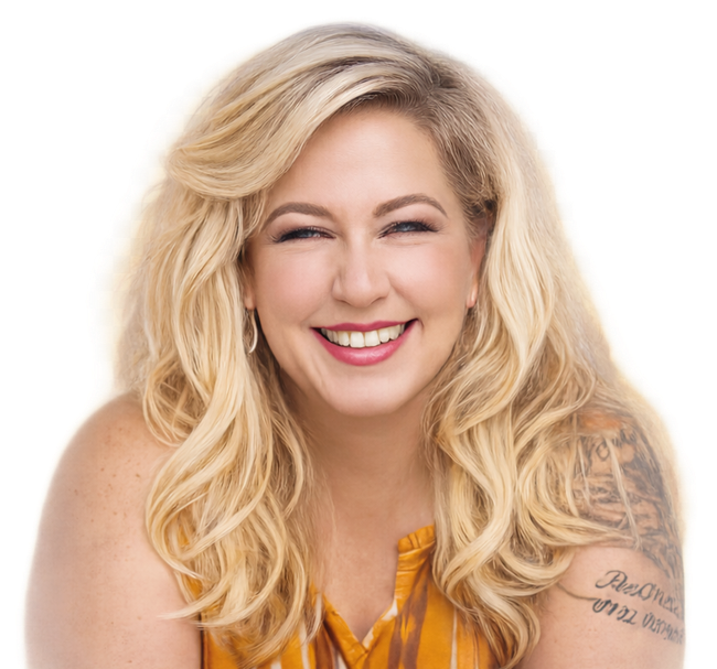 Blonde woman with a bright smile, wearing a yellow top, arm tattoo visible, studio setting.