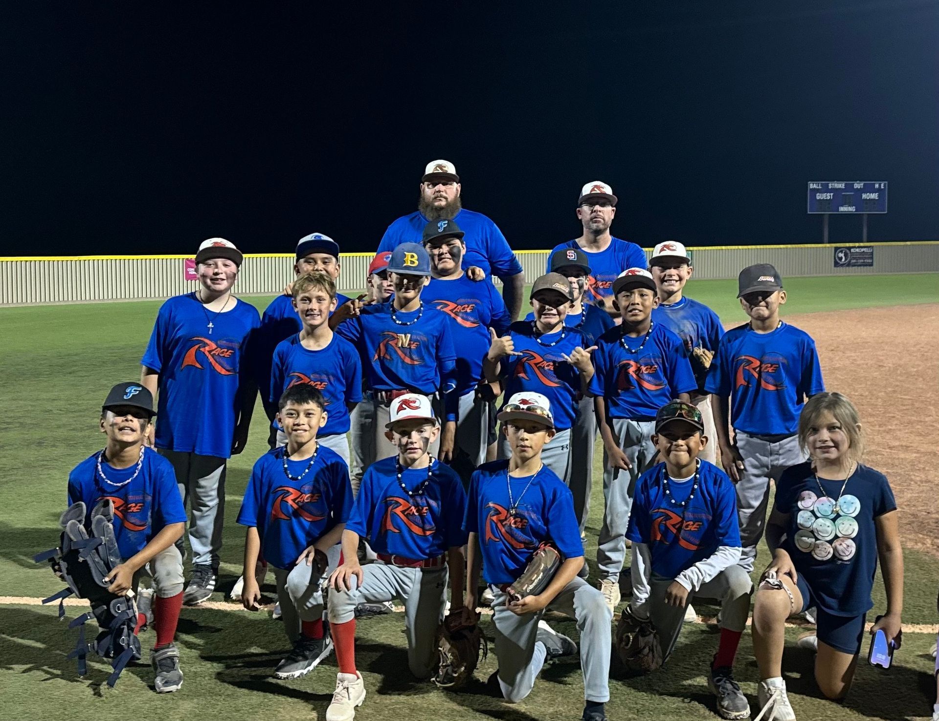 A man wearing a hard hat and goggles is standing in a room.