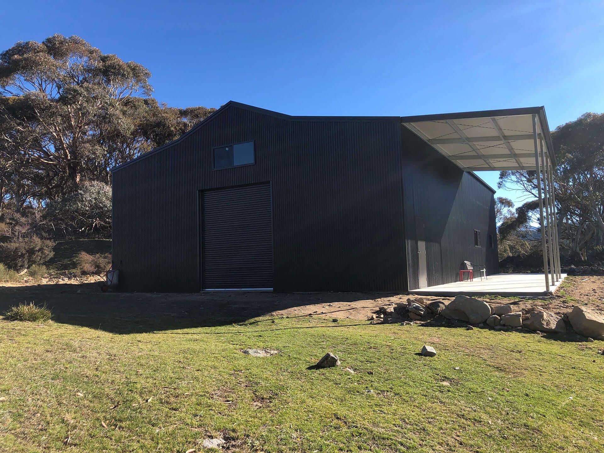 Black 1 door American style barn shed with carport