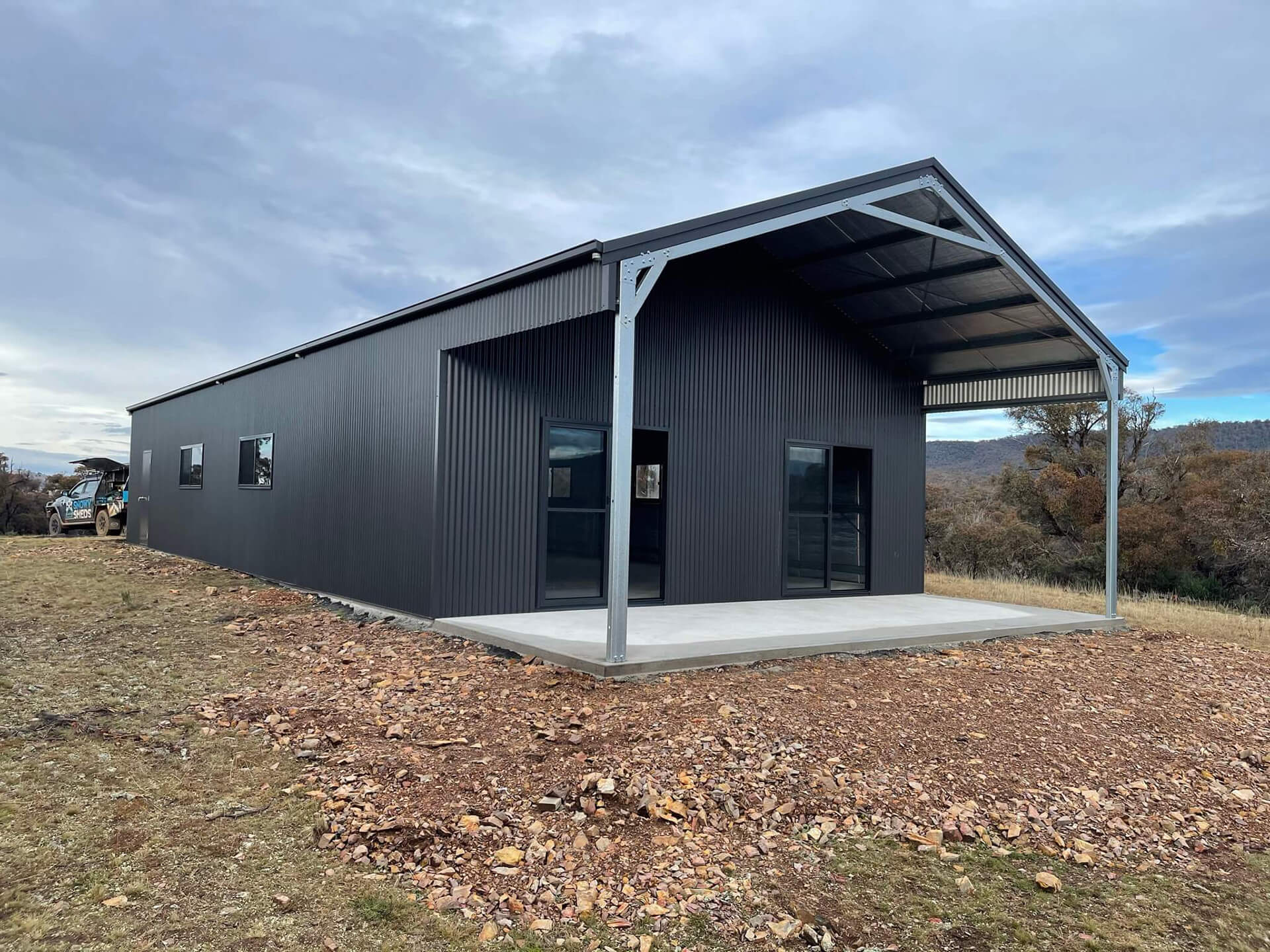 Industrial black shed with carport - Snowy Sheds