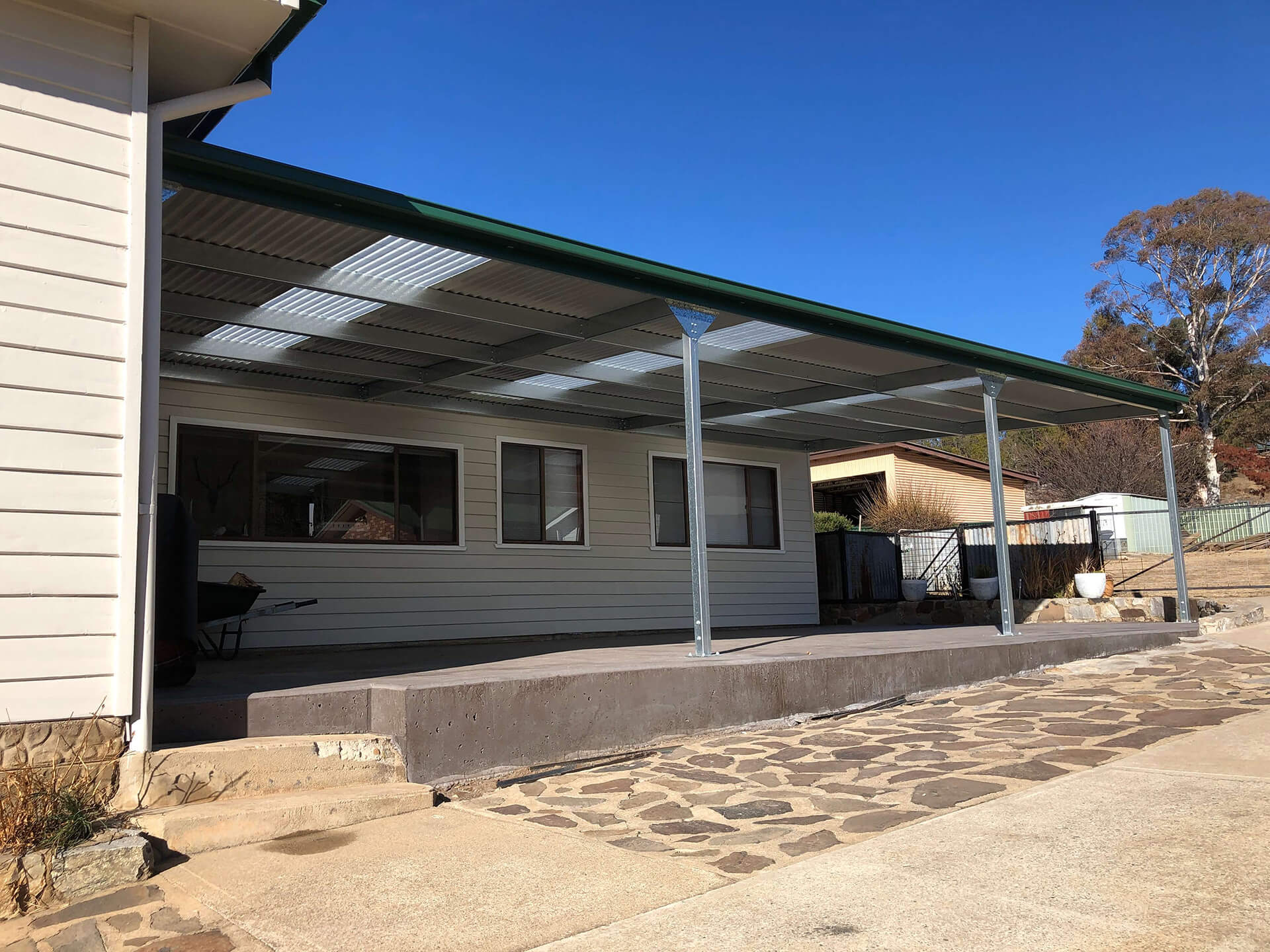 Flat roof Carport attached to house - Snowy Sheds