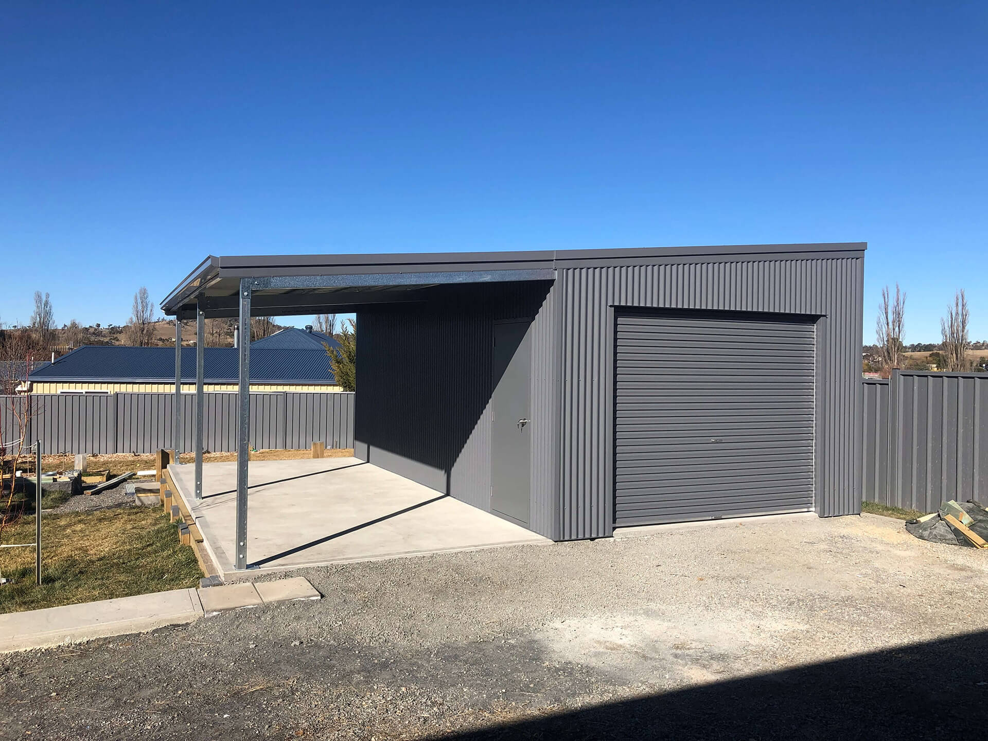 black shed with carport - Snowy Sheds