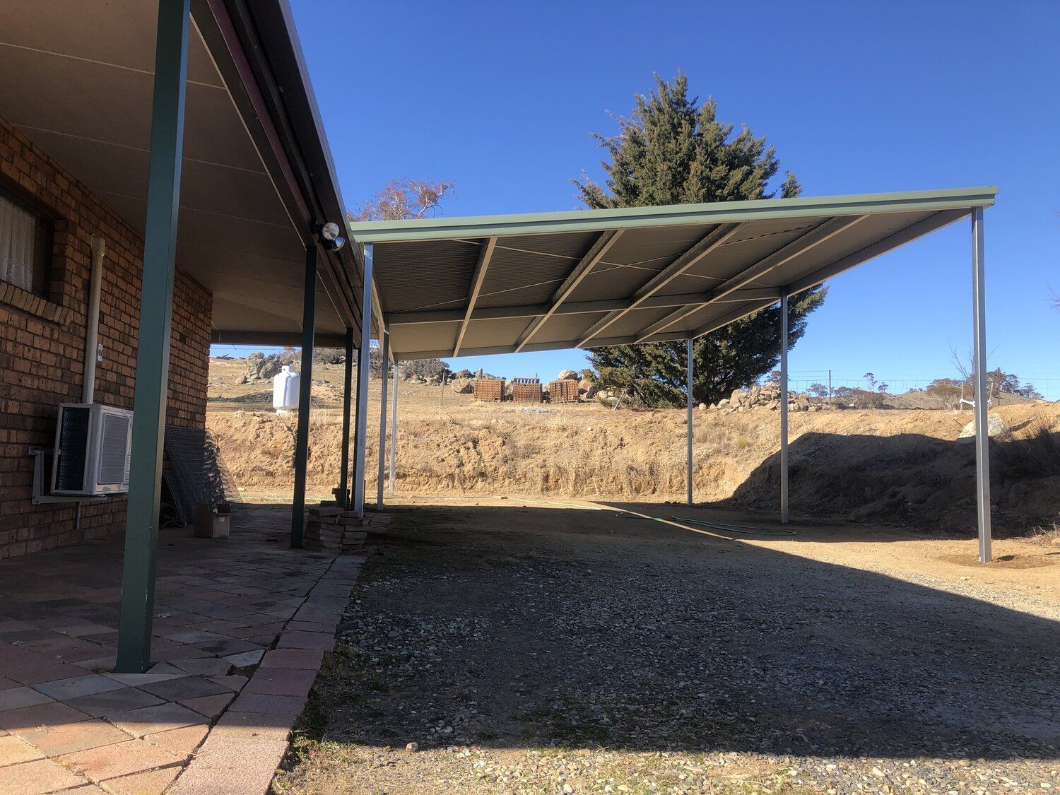 Flat roof Carport attached to house - Snowy Sheds