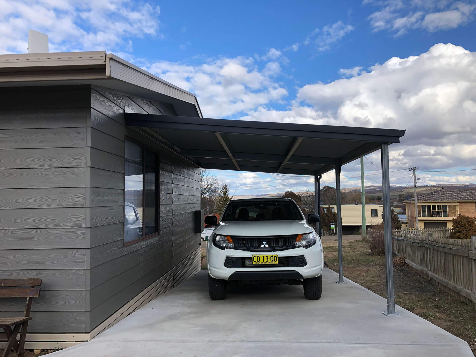 Flat roof Carport attached to house - Snowy Sheds