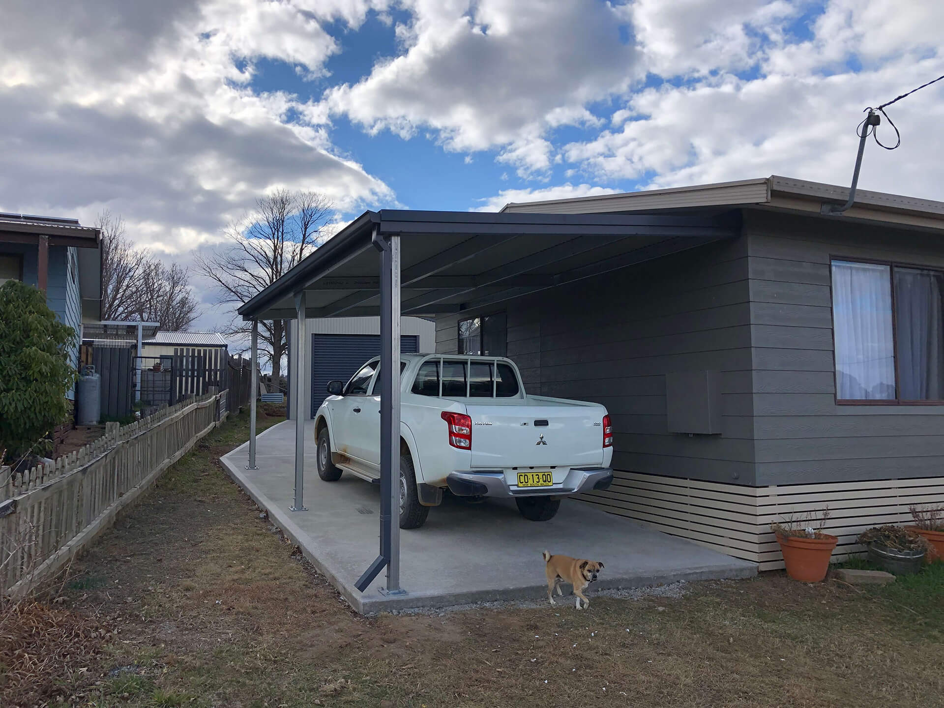 Flat roof Carport attached to house - Snowy Sheds