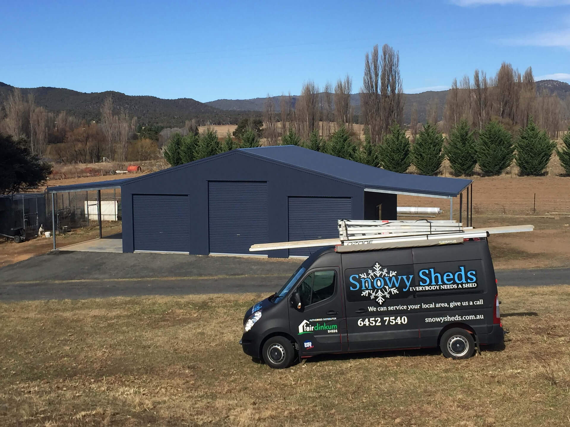 Industrial Steel black Shed with van in front - Snowy Sheds