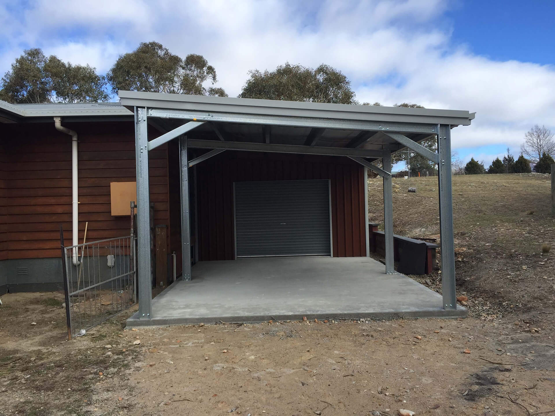 Flat roof Carport attached to house - Snowy Sheds