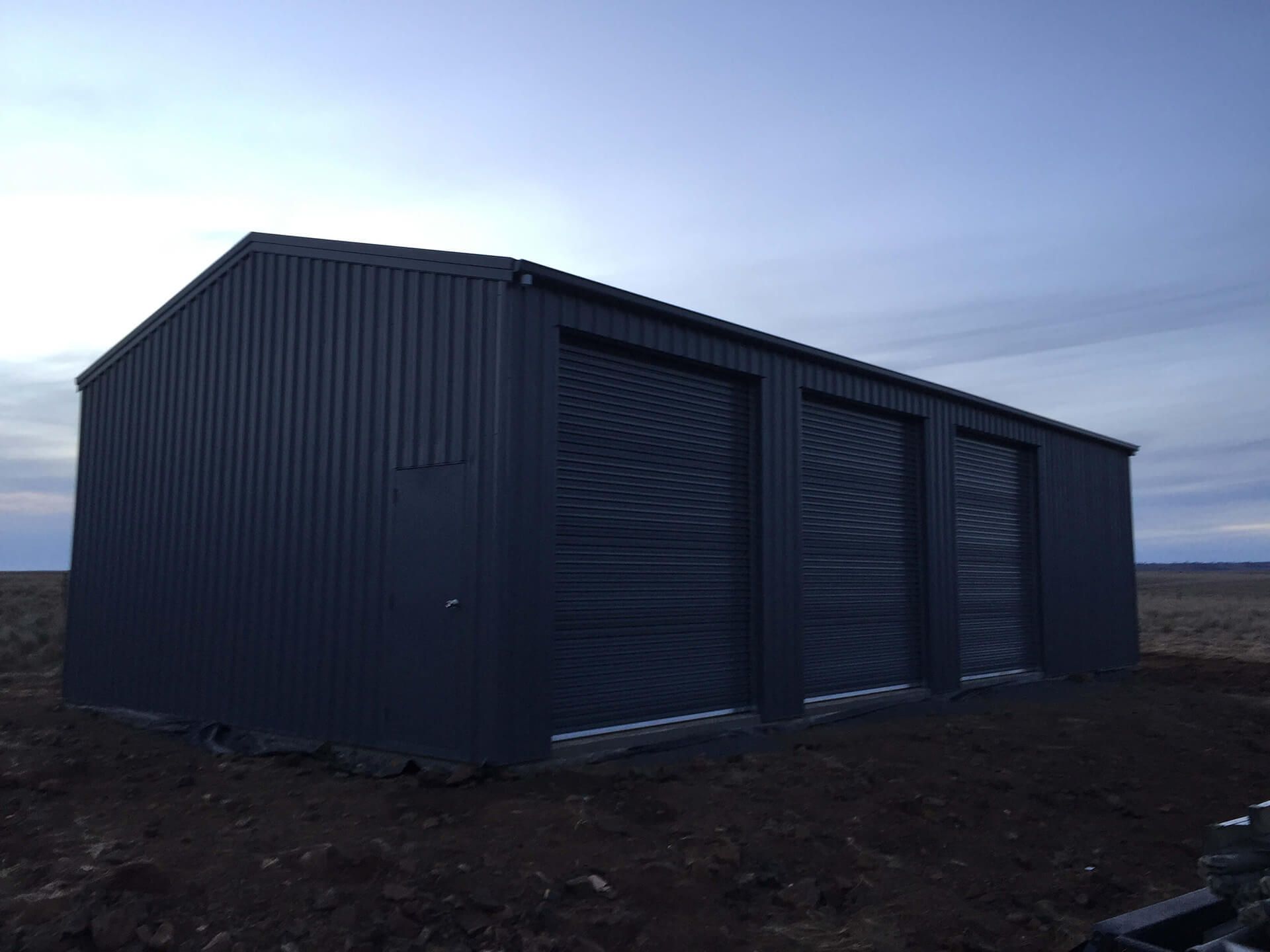 Industrial 3 door shed at night - Snowy Sheds