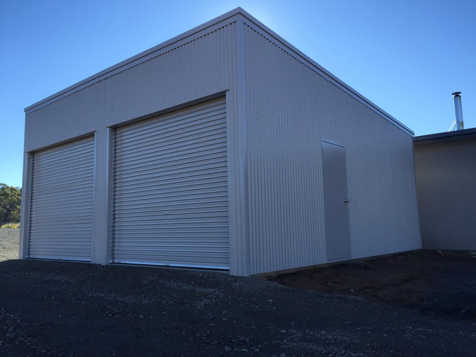 white small 3 door shed with white doors  - Snowy Sheds