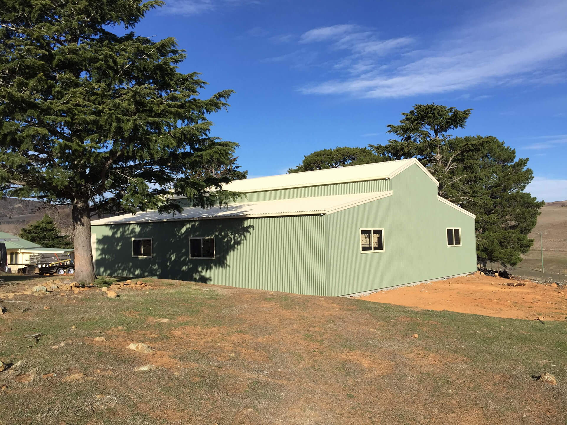 green 3 door American style barn shed
