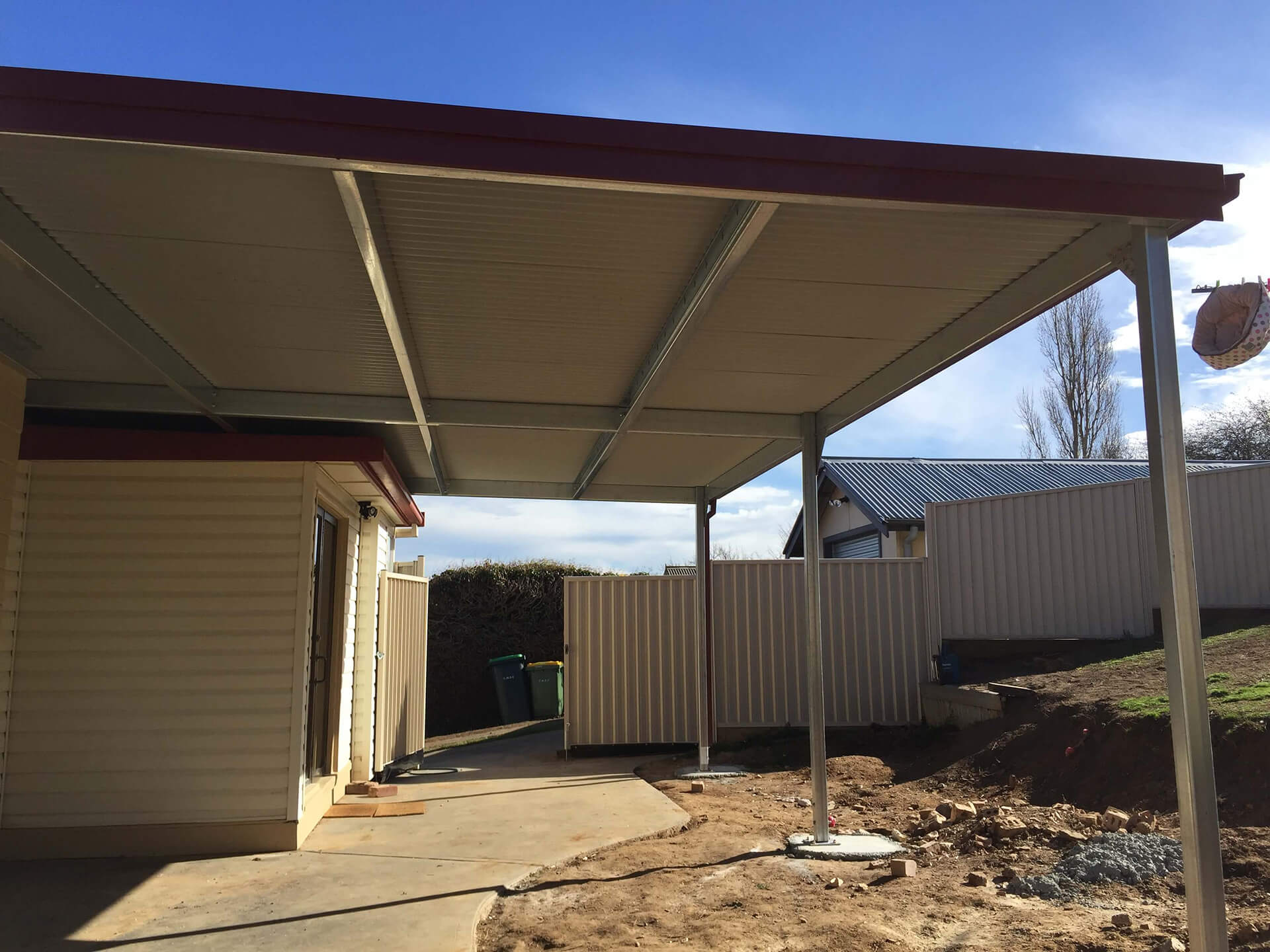 Flat roof Carport attached to house - Snowy Sheds