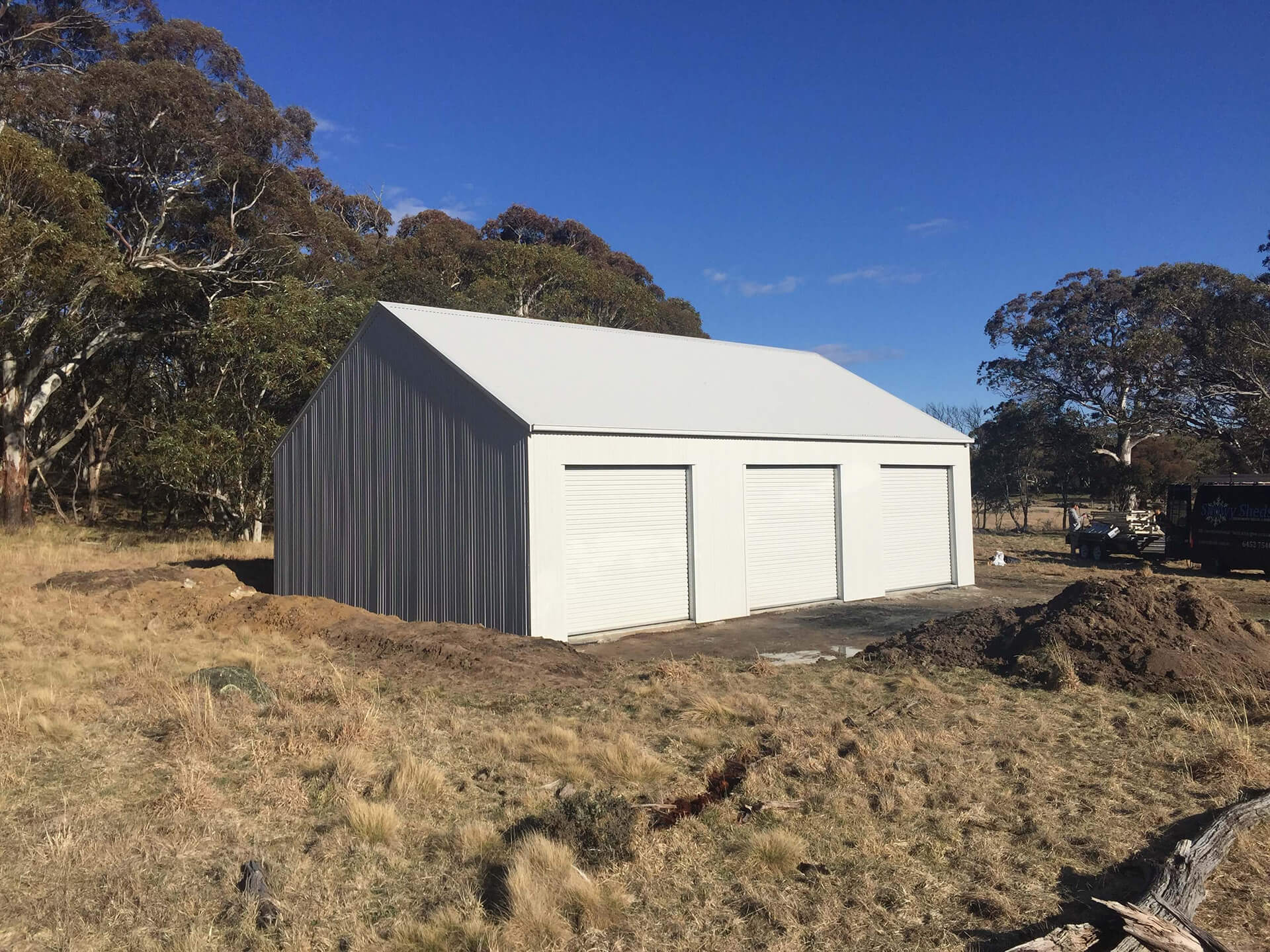 white small 3 door shed with white doors  - Snowy Sheds