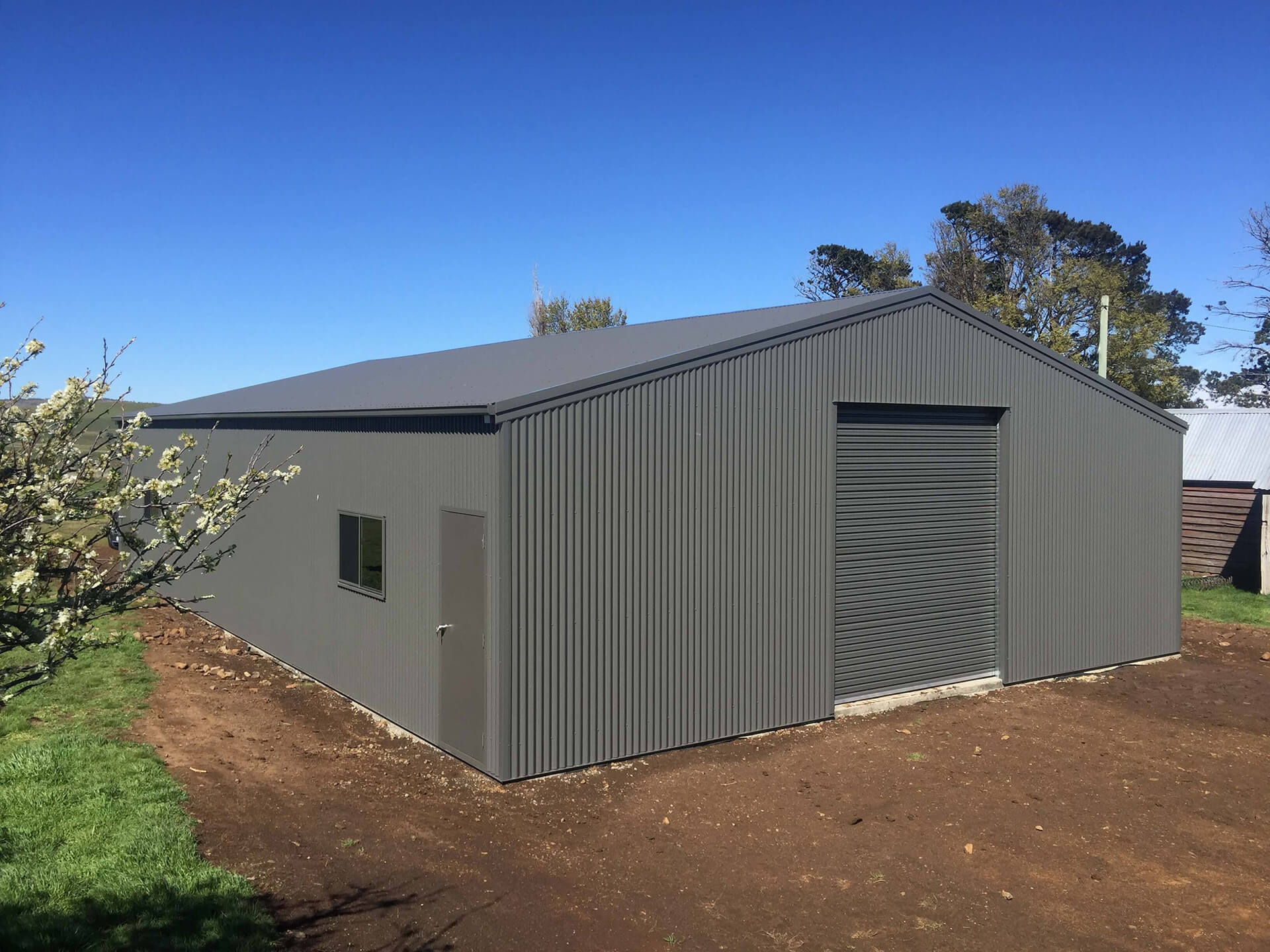 Industrial grey shed with grey doors - Snowy Sheds