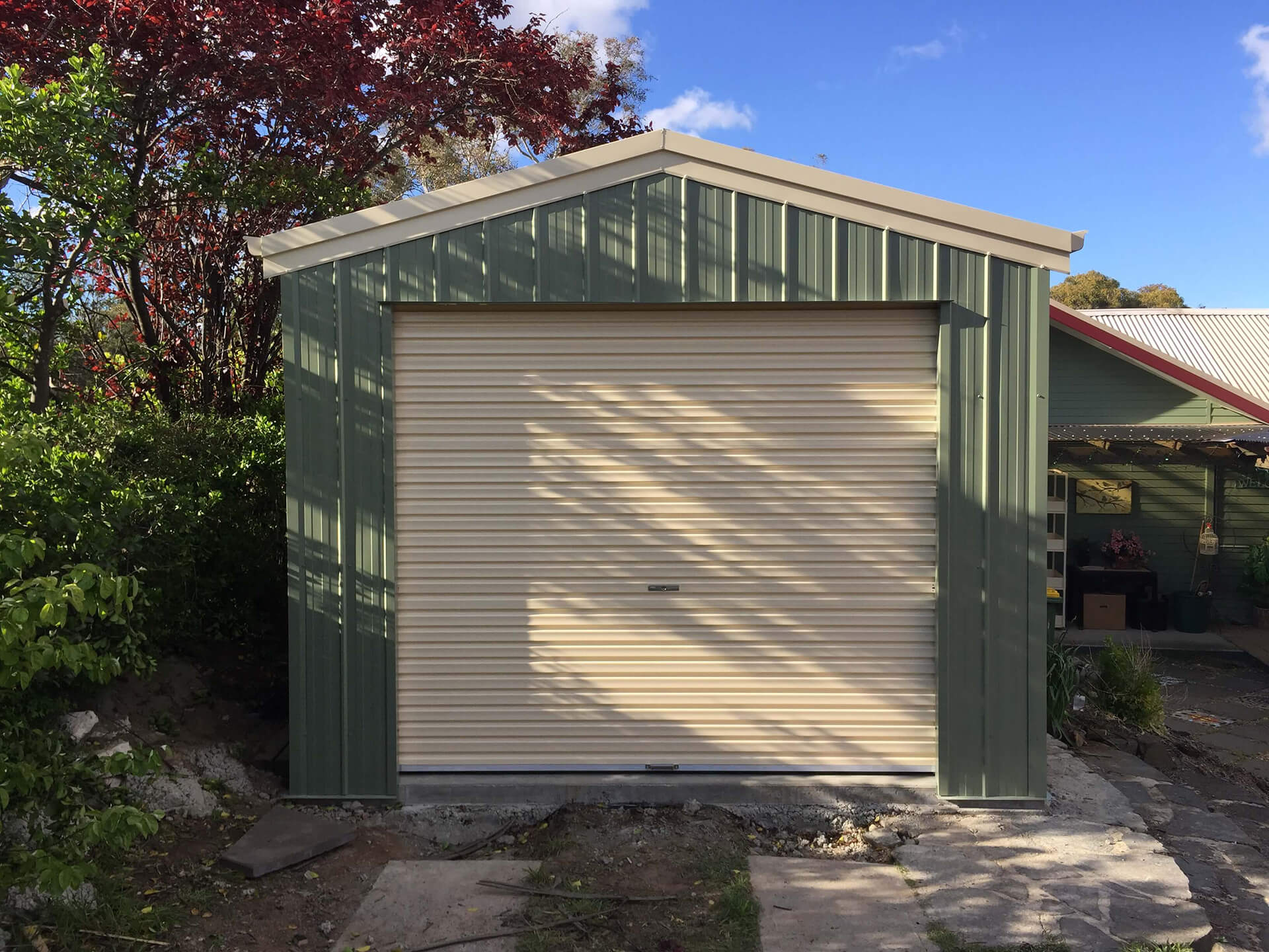green shed white door  - Snowy Sheds