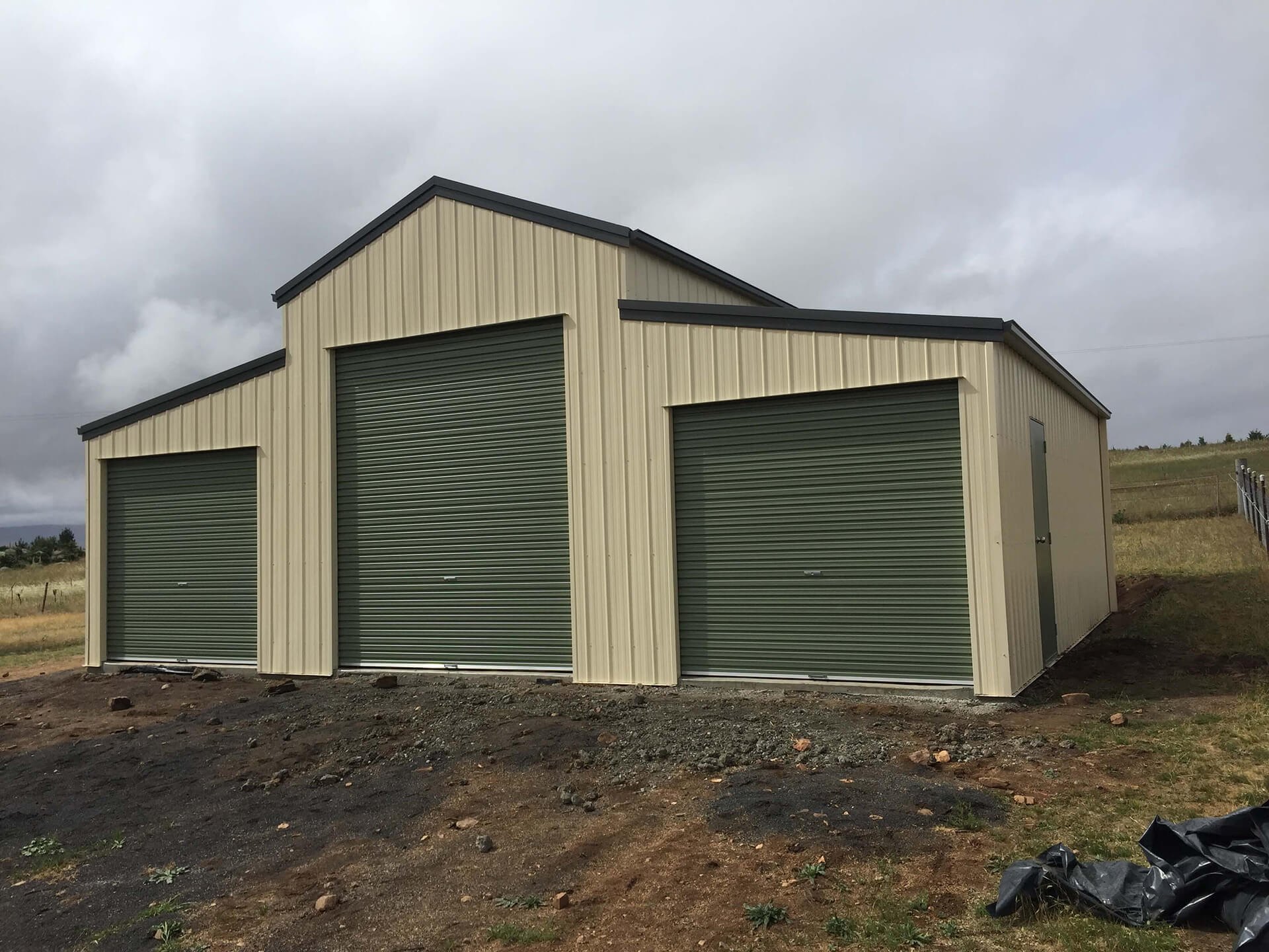 Yellow 3 door American style barn shed side angle