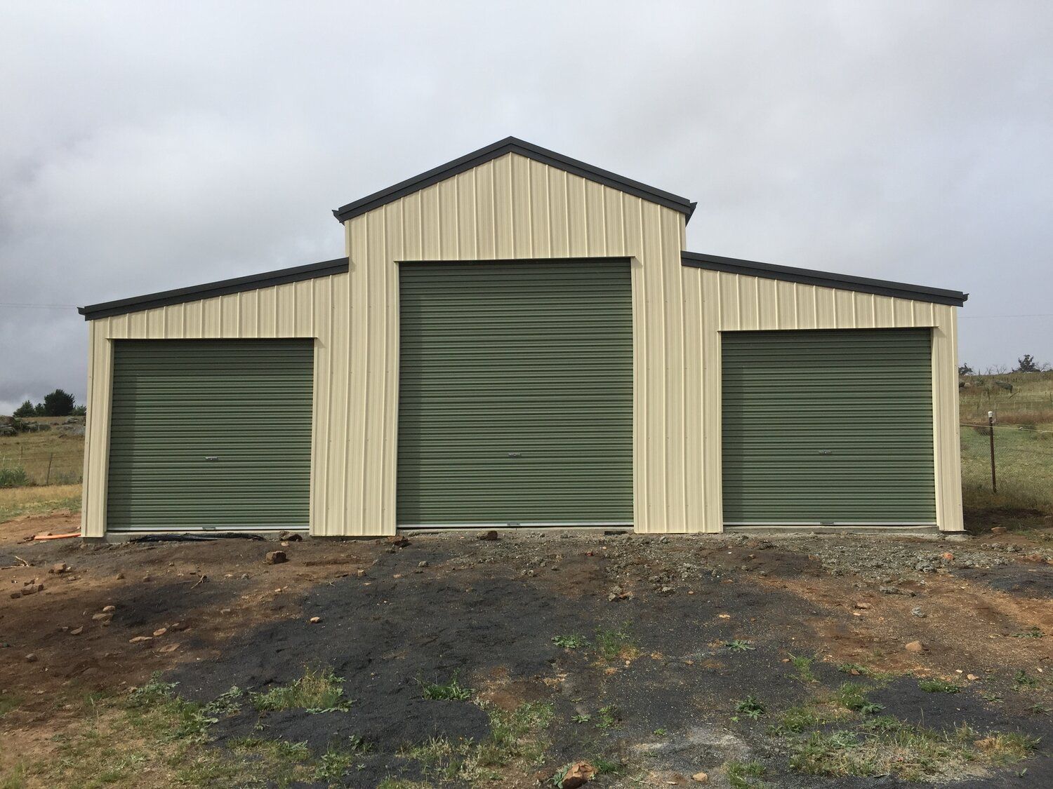 Large Cream and Green American Barn shed with three roller doors - Snowy Sheds