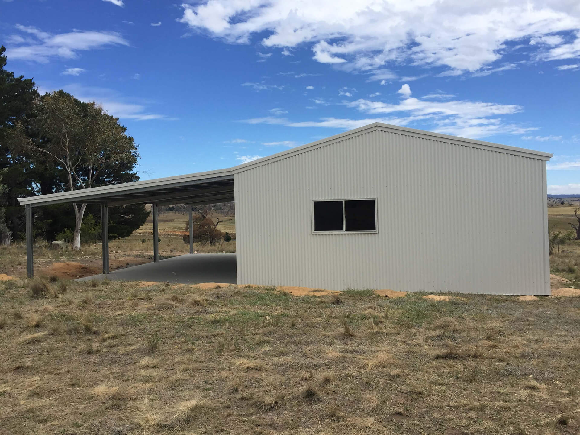 Flat roof Carport attached to house - Snowy Sheds