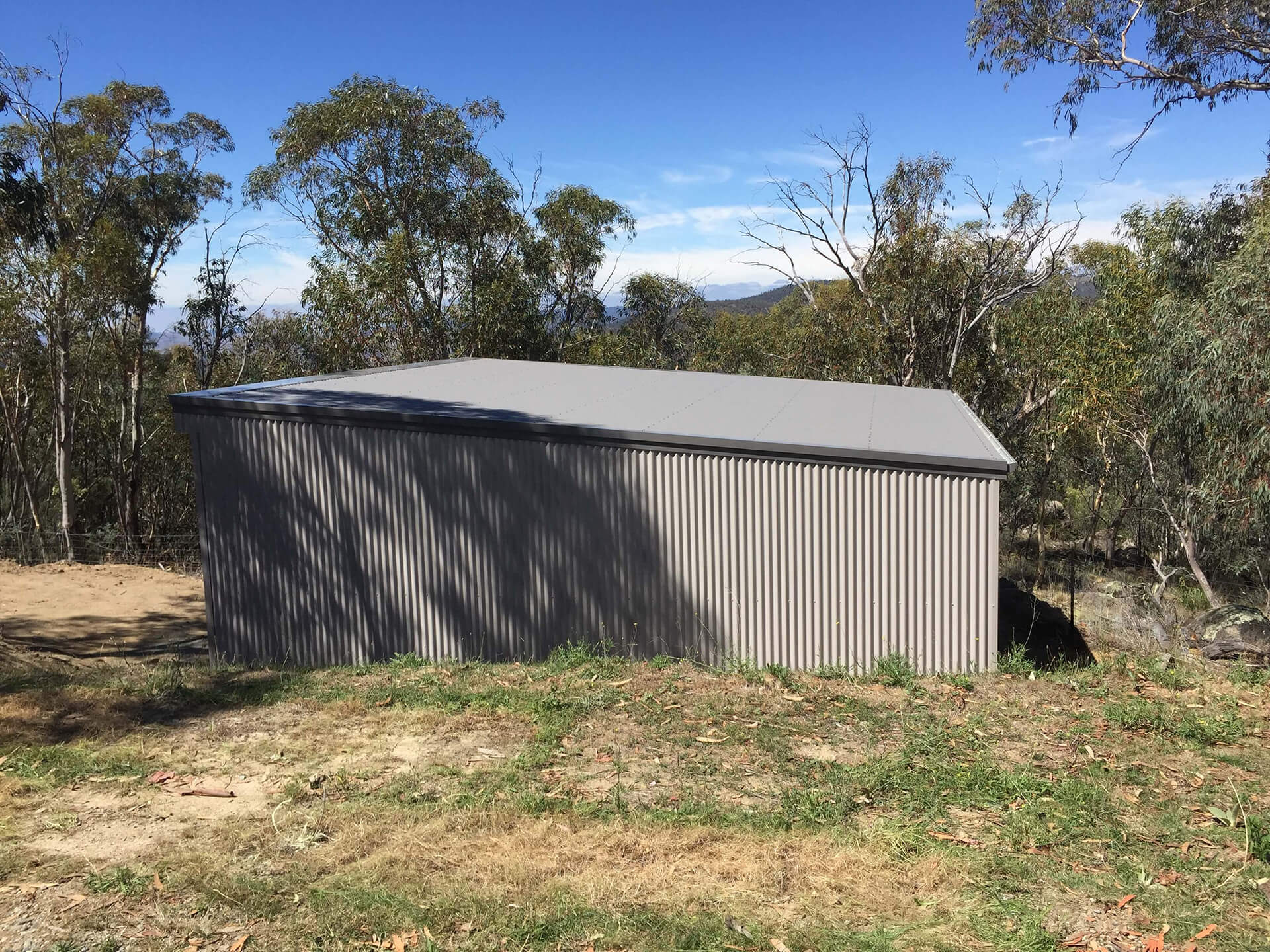Flat roof Carport attached to house - Snowy Sheds