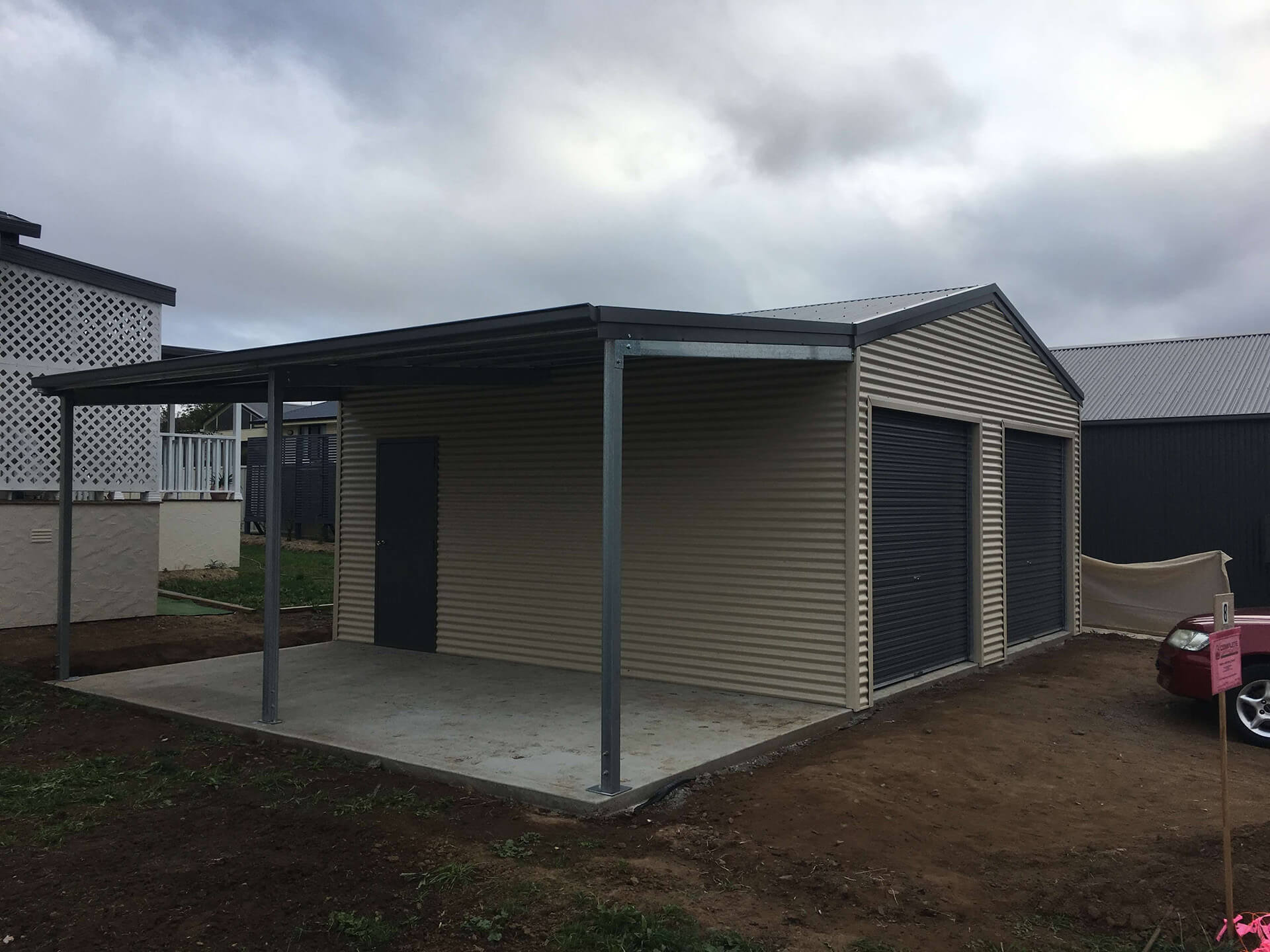 Flat roof Carport attached to house - Snowy Sheds