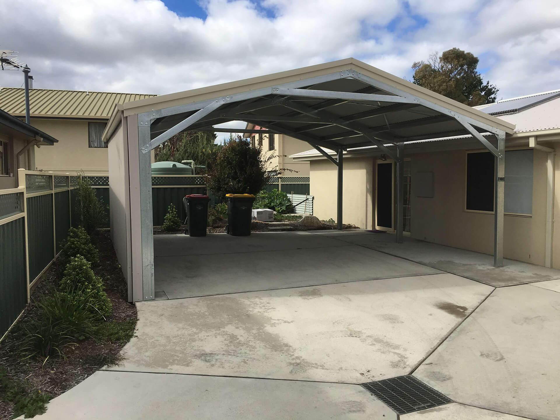 Flat roof Carport attached to house - Snowy Sheds