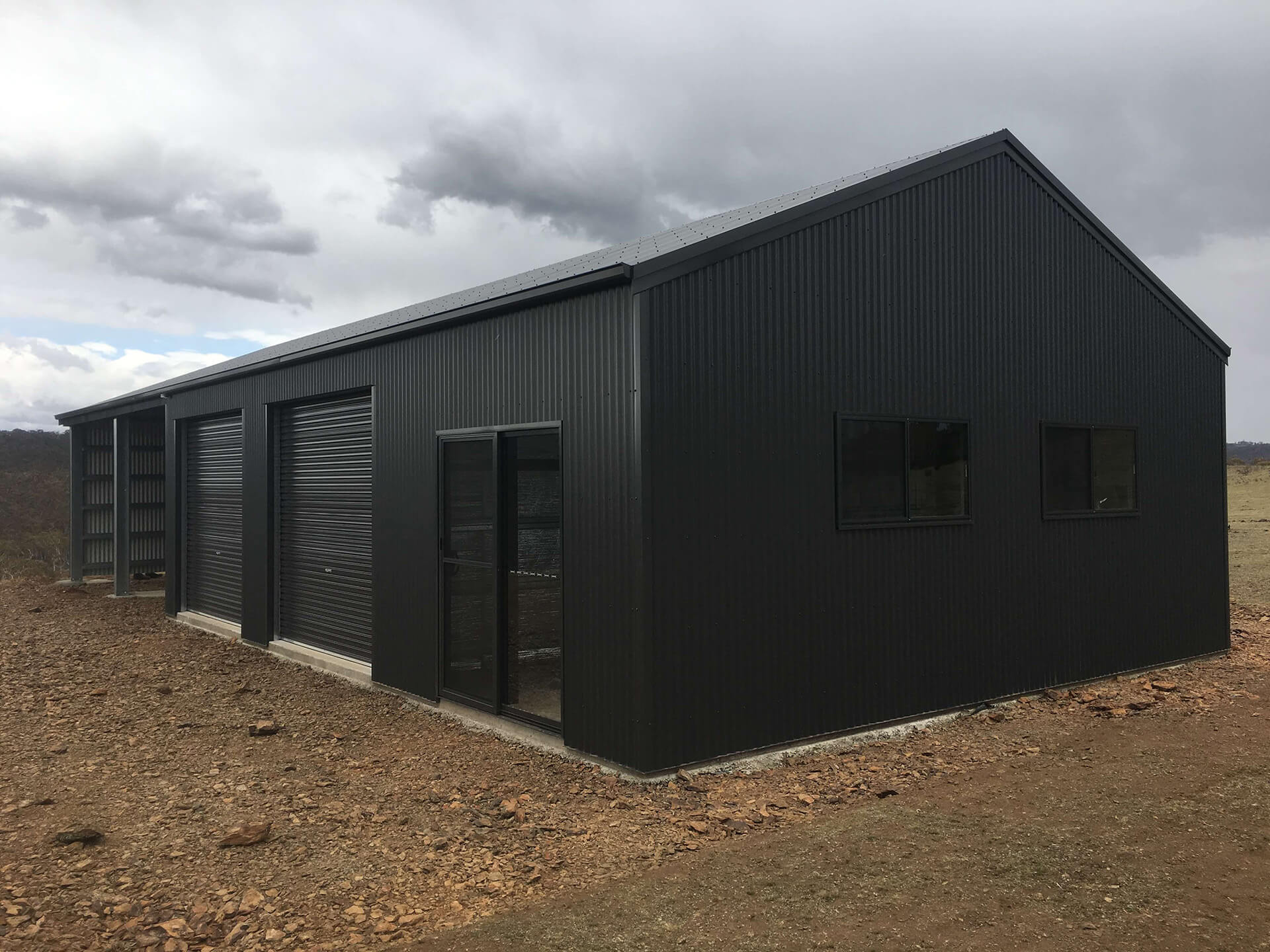 Flat roof Carport attached to house - Snowy Sheds