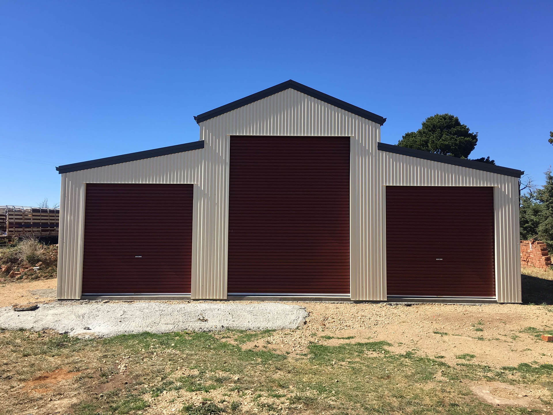 white 3 door American style barn shed