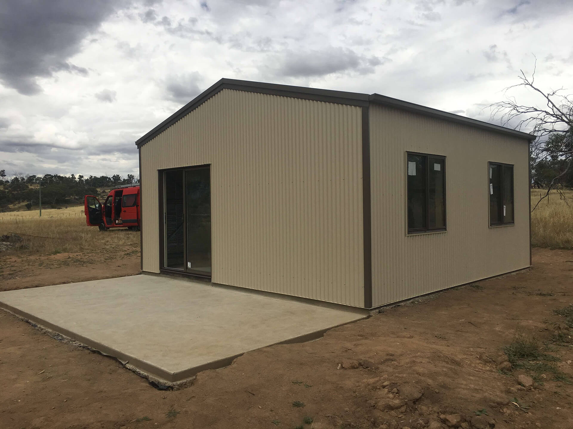 Cream shed with green trims  - Snowy Sheds