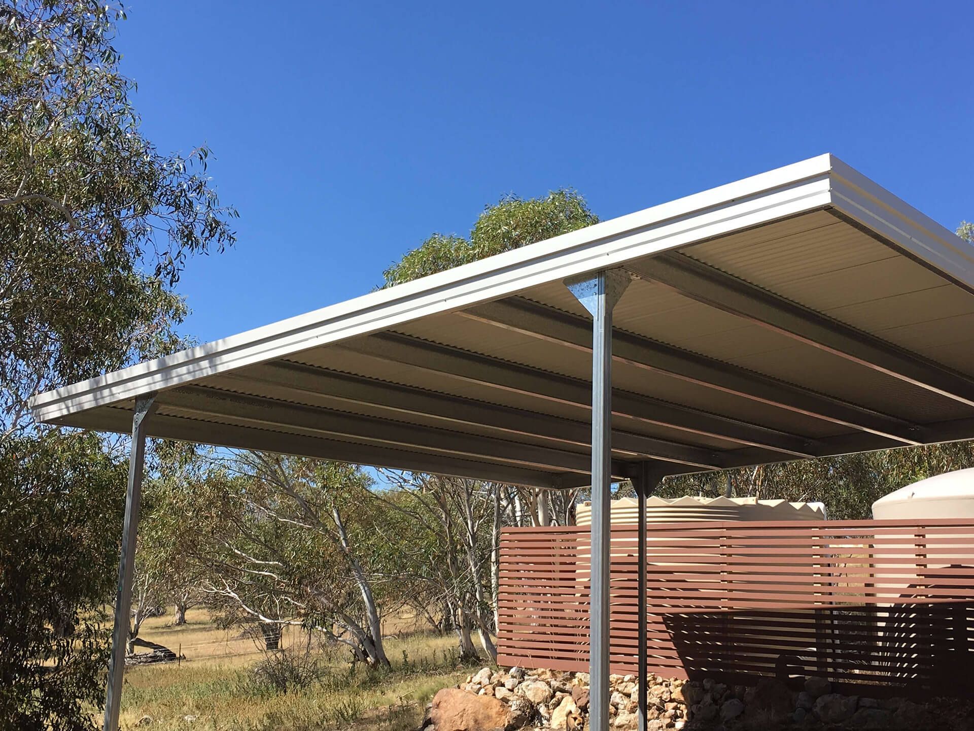 Flat roof Carport attached to house - Snowy Sheds