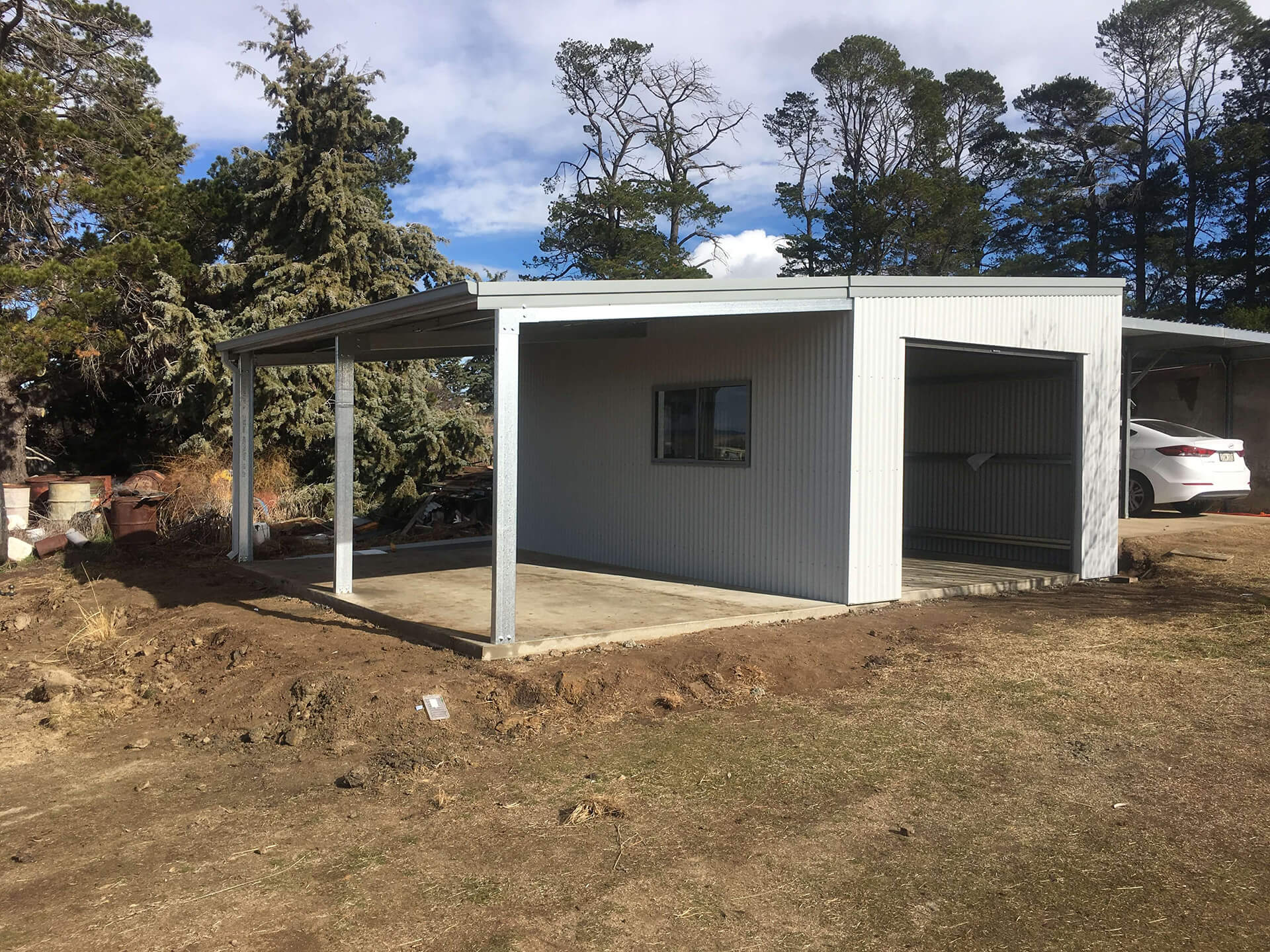 Flat roof Carport attached to house - Snowy Sheds