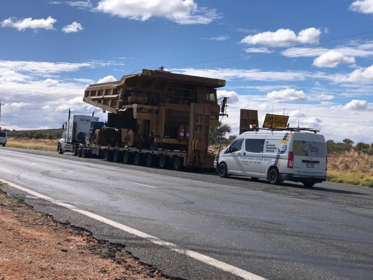 Oversized Equipment Transported on a Multi-axle Trailer, Escorted by a Support Van — Col Adamson Transport Services in Farleigh, QLD